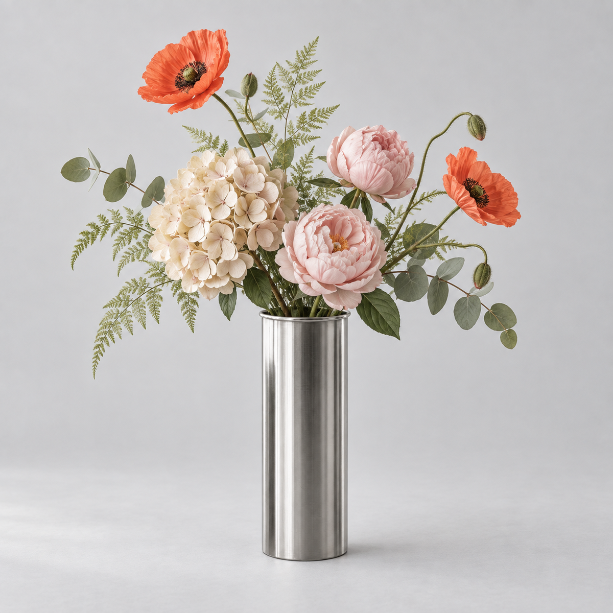 Cylinder · stål vase med blomster